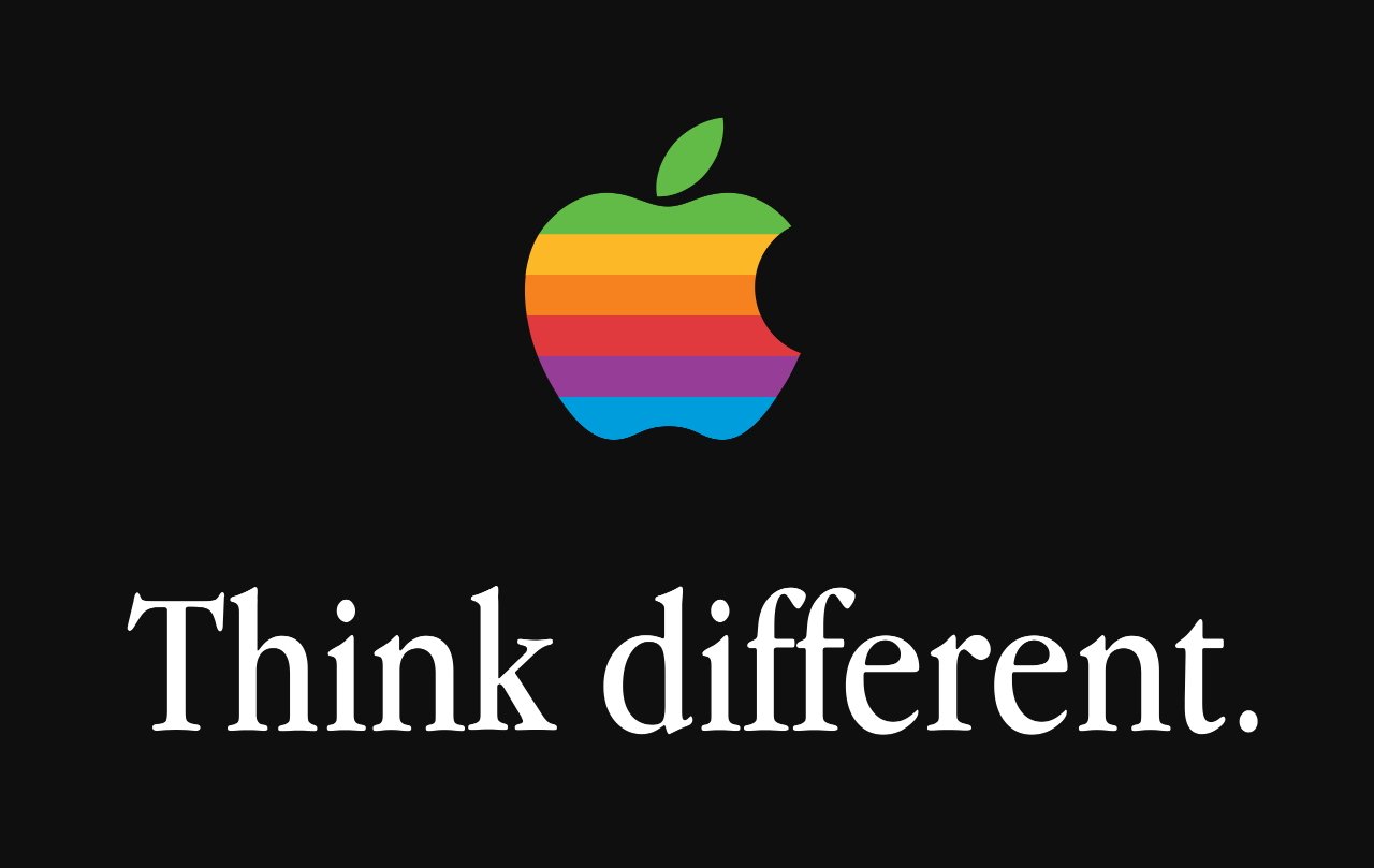 Logo Rainbow Apple nad textem Think different. na černém pozadí.